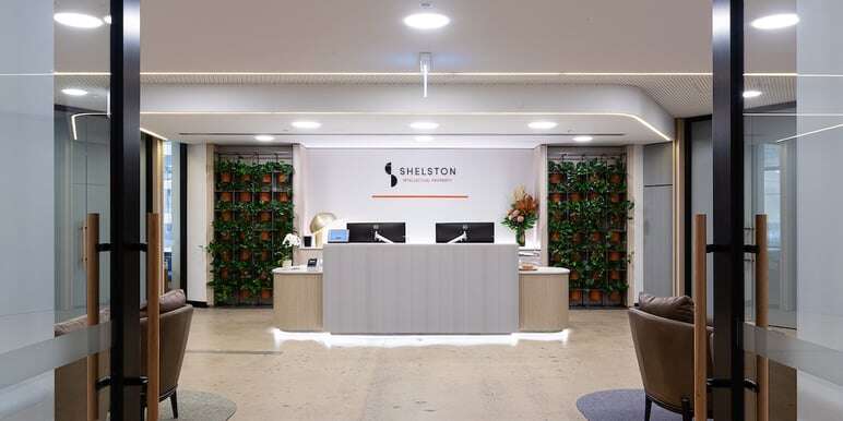 reception area entry doors computer tables plants