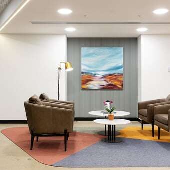 seating area poster lamp round white coffee tables