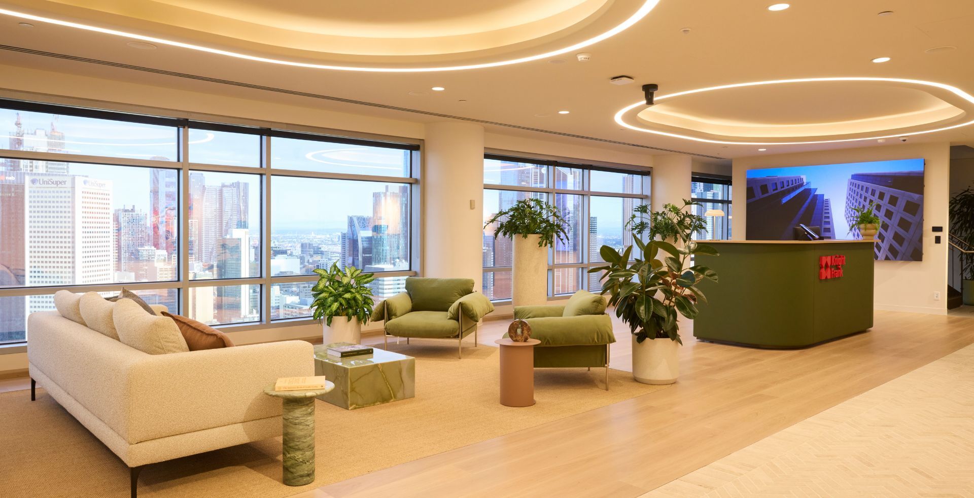 Reception and lounge area balancing comfort, connection and expansive views across Melbourne.