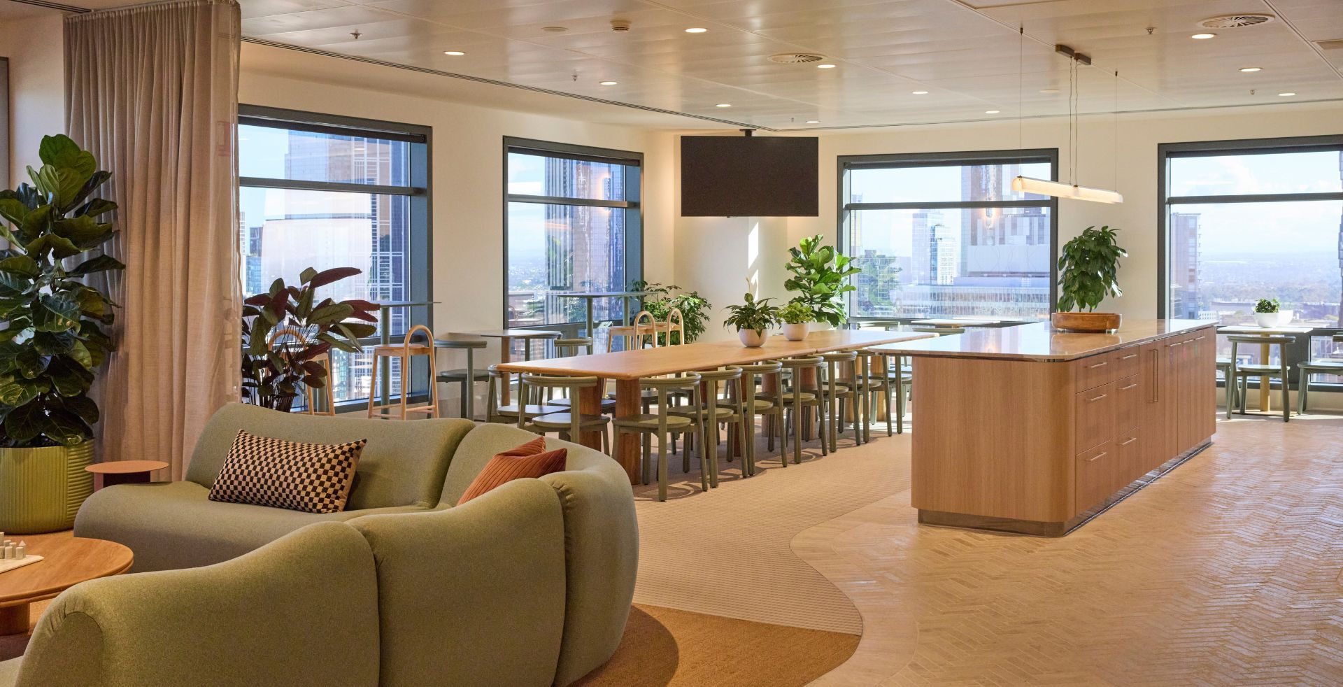 Timber kitchen and breakout space designed to support connection throughout the working day.