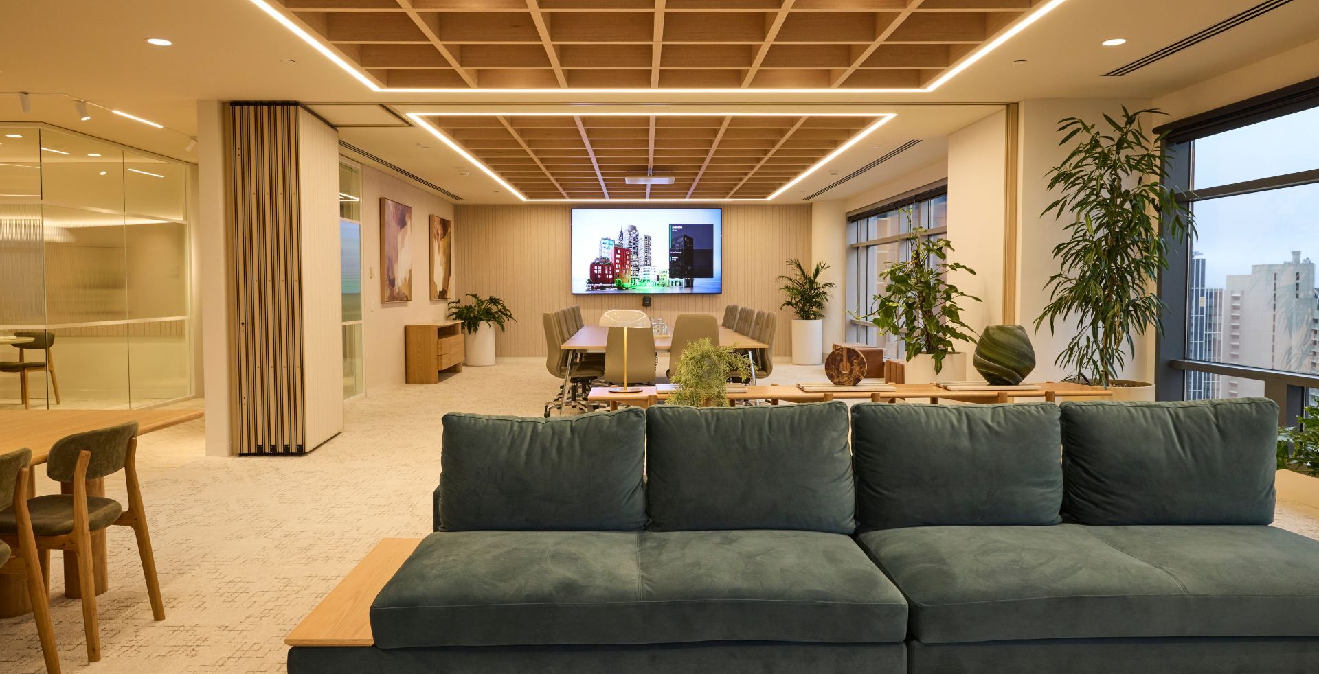 Open collaboration zone connecting informal work settings, meeting spaces and communal areas.