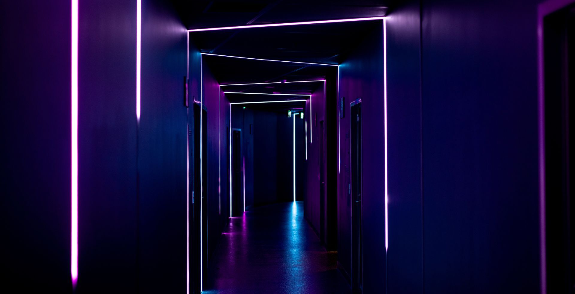 Neon-outlined doorways leading to the escape rooms at The Great Escape, Flinders Street Melbourne
