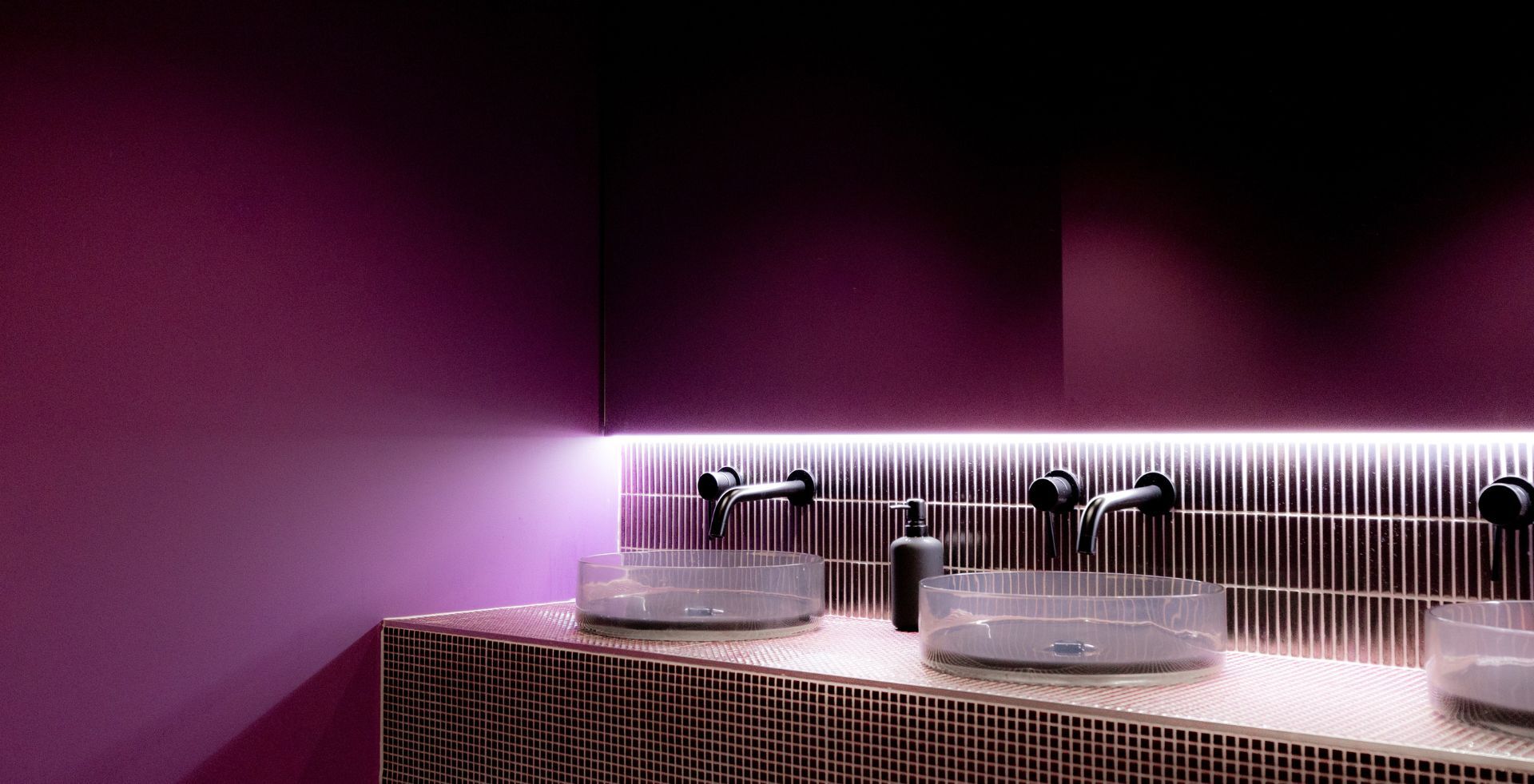 Mosaic-tiled vanity with concealed strip lighting in The Great Escape's Melbourne bathrooms