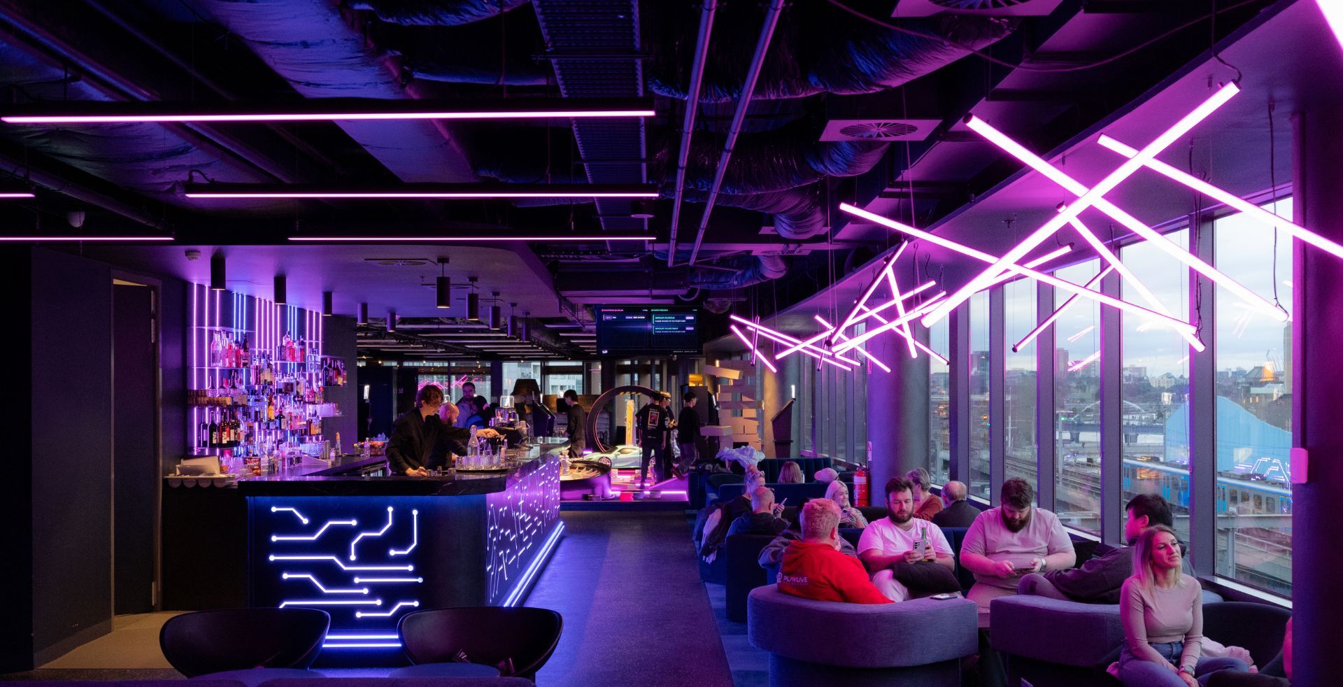 Bar and lounge overlooking the rail corridor at The Great Escape Melbourne, fitout by Amicus