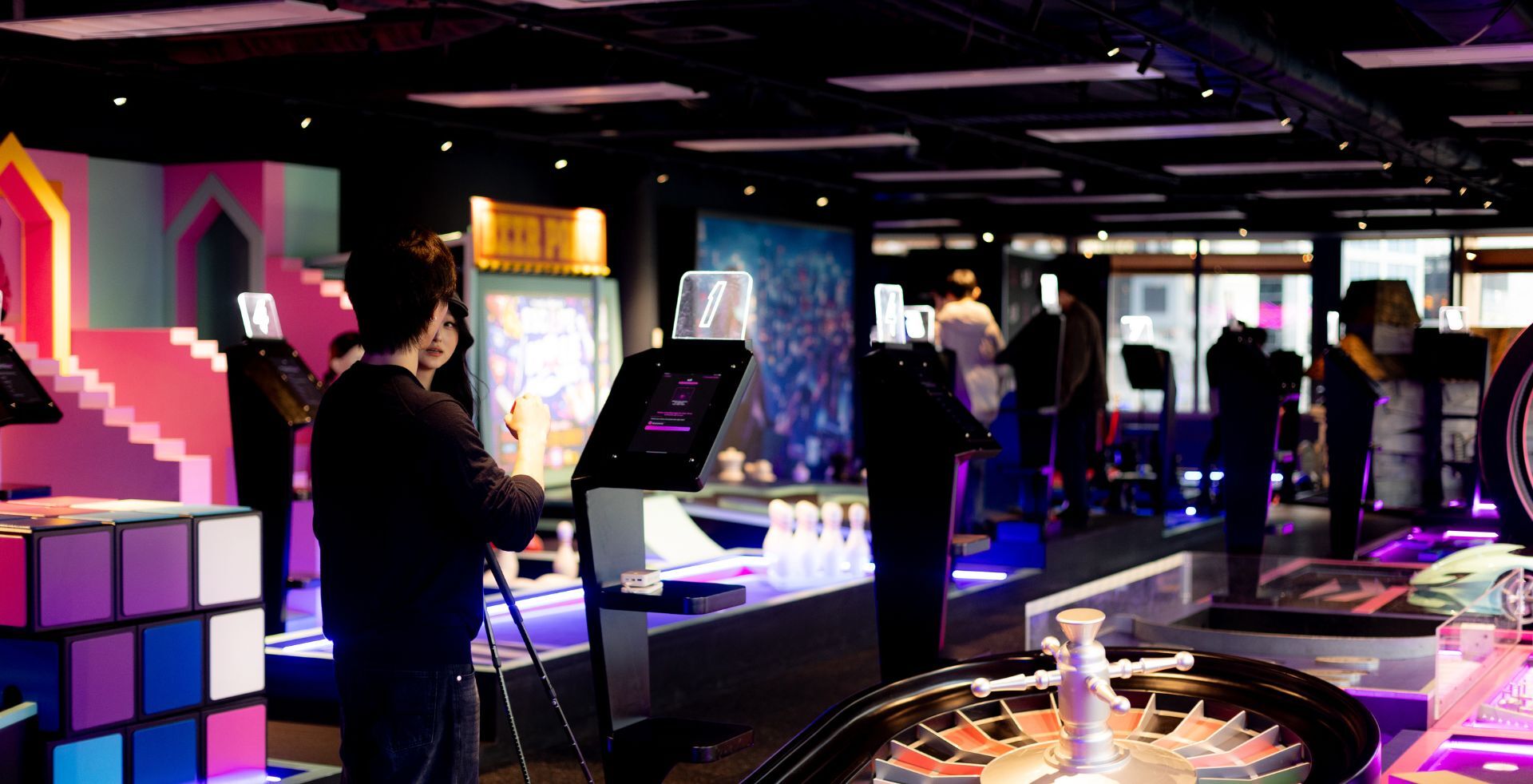 Rubik's cube hole and arcade machines on the mini golf course at The Great Escape Melbourne