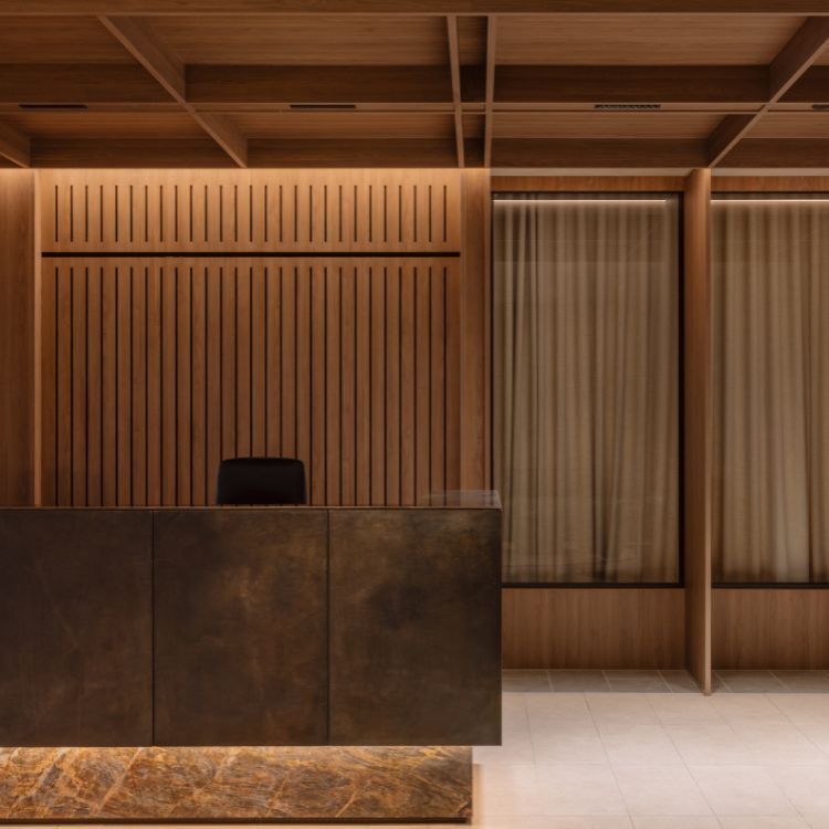 Battened timber wall behind the bronze reception counter in Mazzei's Victorian workplace