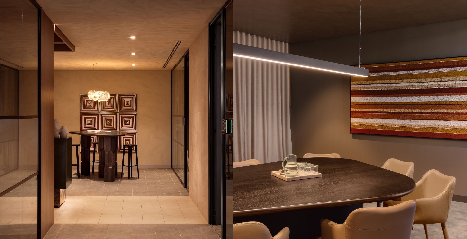 Standing bar table and oval meeting room, each anchored by artwork, in the Mazzei workplace