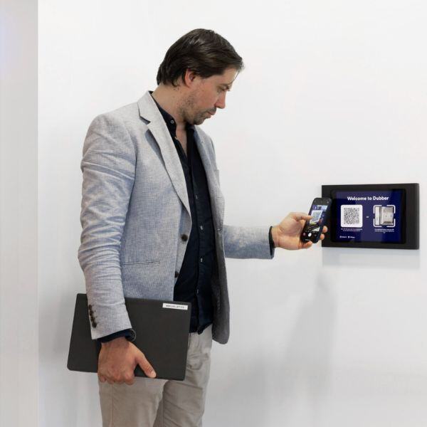 person using a visitor management system