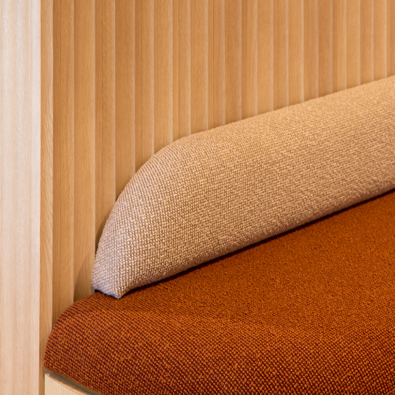 Detailed timber banquette seating inside the Kyko Spec Suite.