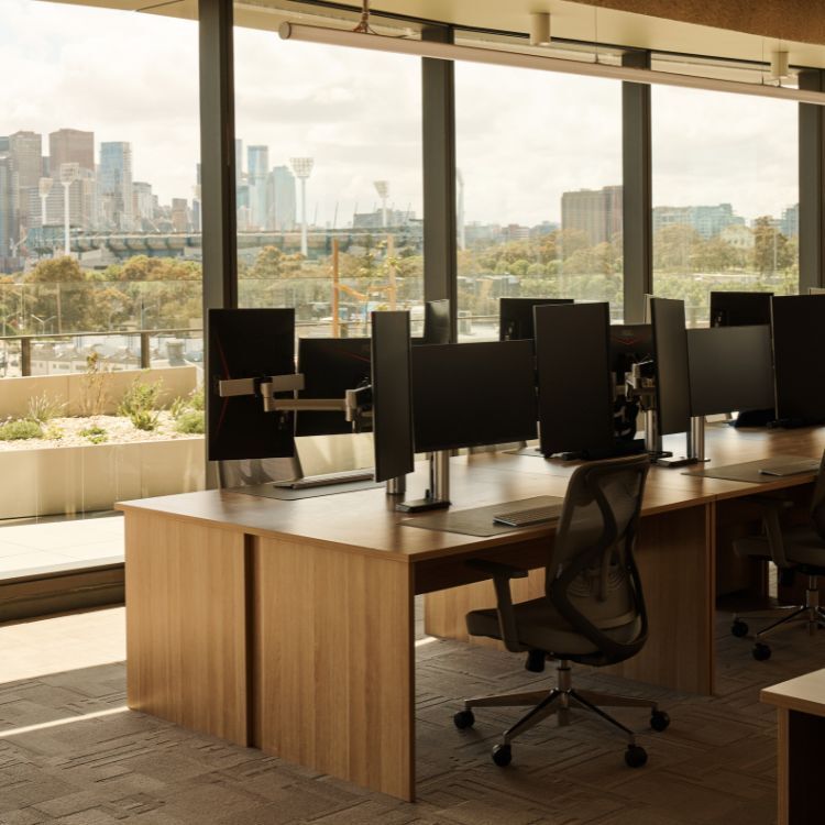 Modern workstations with sleek timber desks and integrated technology