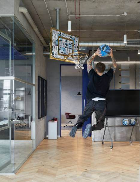 man shooting hoops in a commercial office