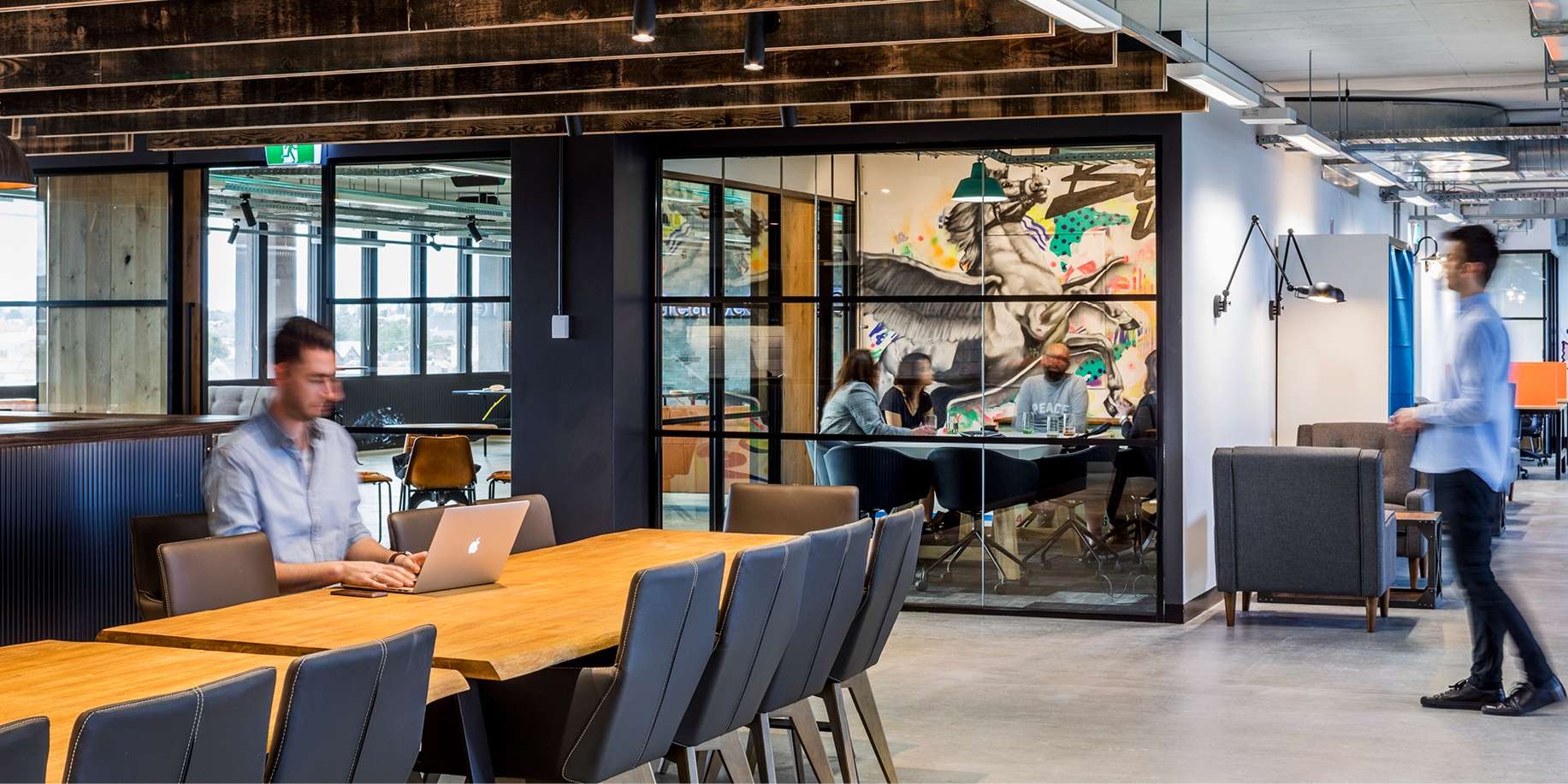 People working in a contemporary designed office environment