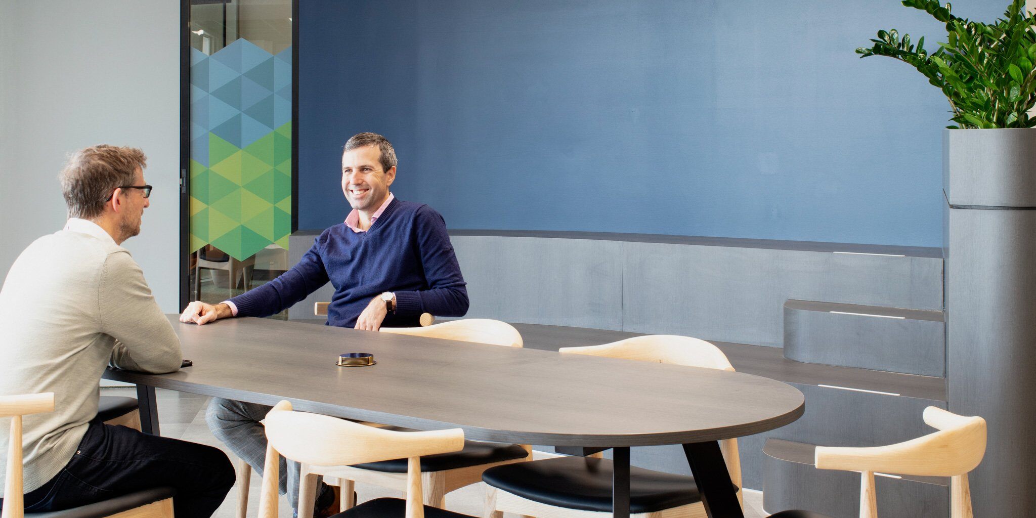 People collaborating in dynamic meeting room