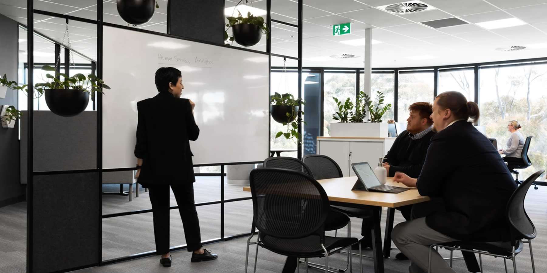 People collaborating in a dynamic office and meeting room