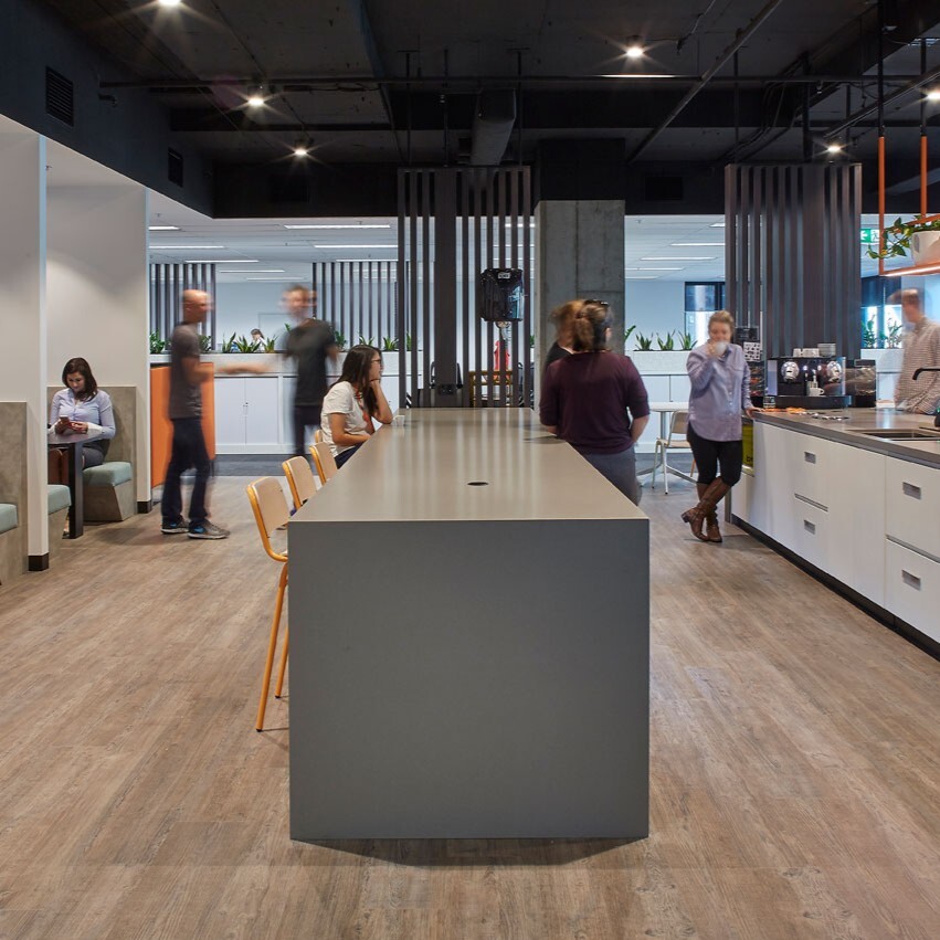 ascender kitchen with employees enjoying the new design
