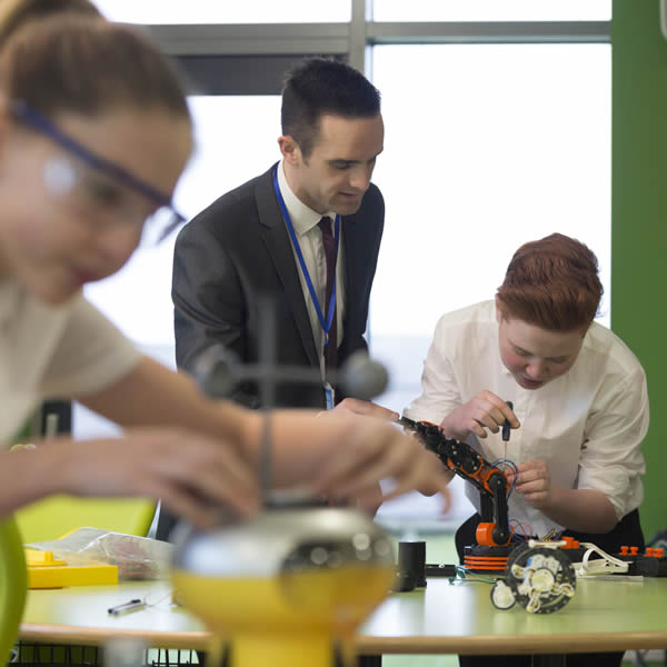 students in school classroom doing STEM work