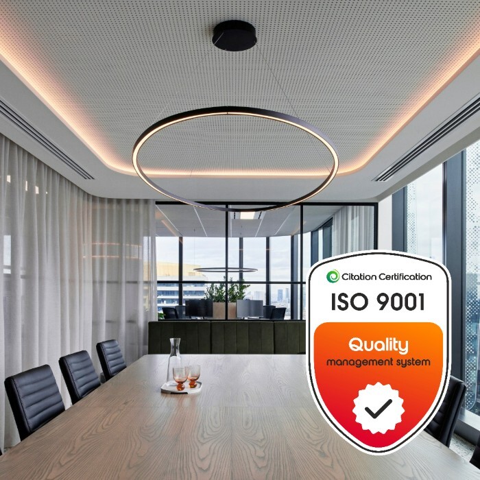 ISO 9001 certified logo against an office boardroom background