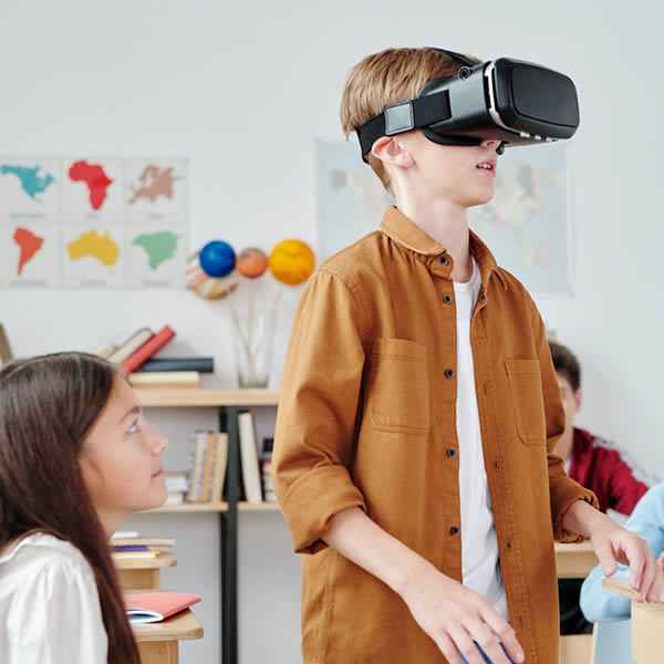 student in a school classroom learning about VR
