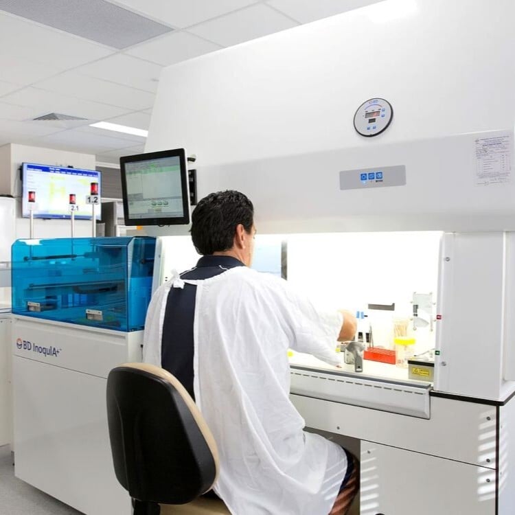 A pathologist at work in a pathology lab designed by Amicus