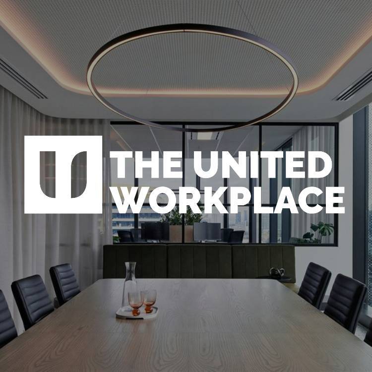 the united workplace logo over an office boardroom design