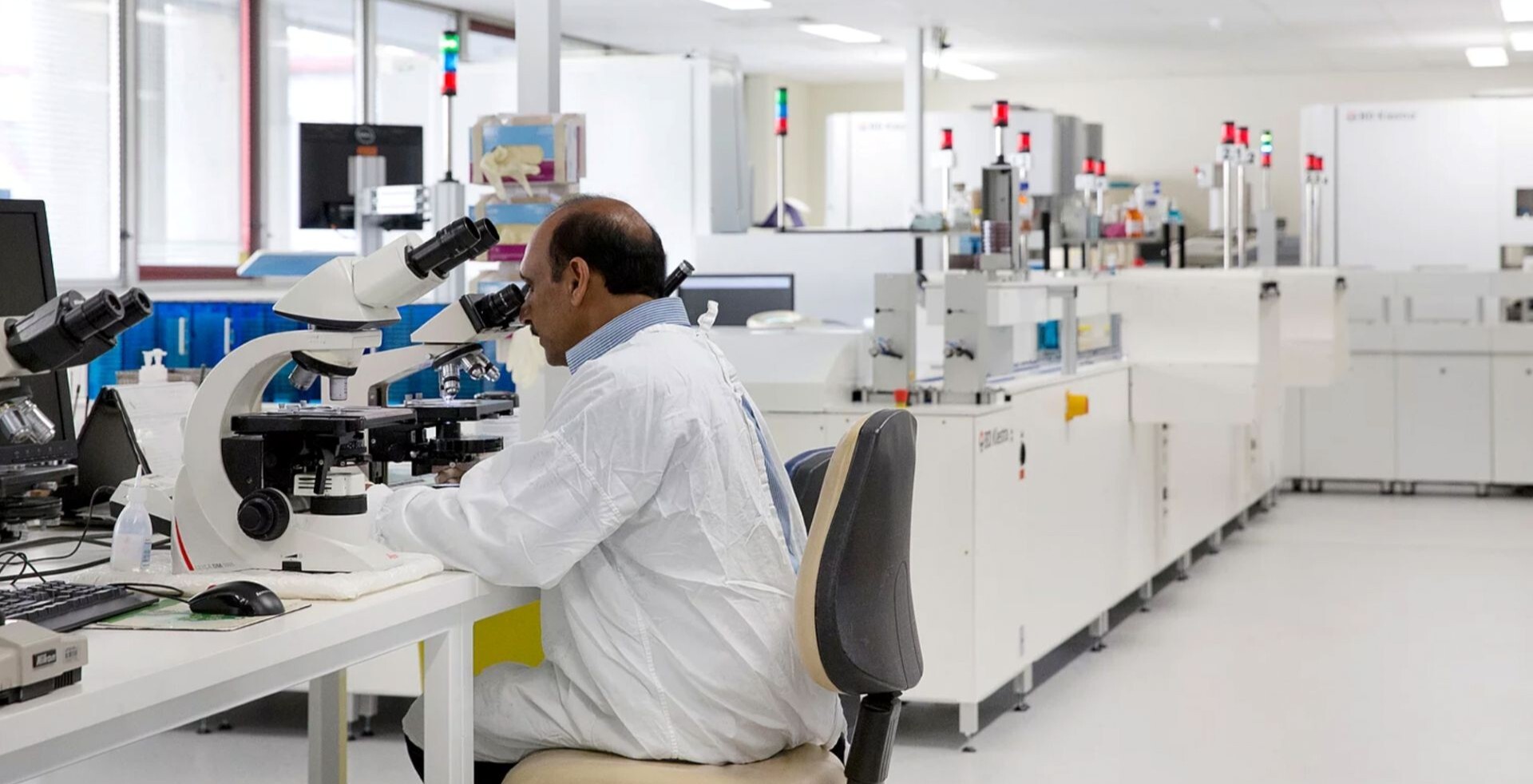 Microbiologist in medical lab fit out by Amicus in Sydney