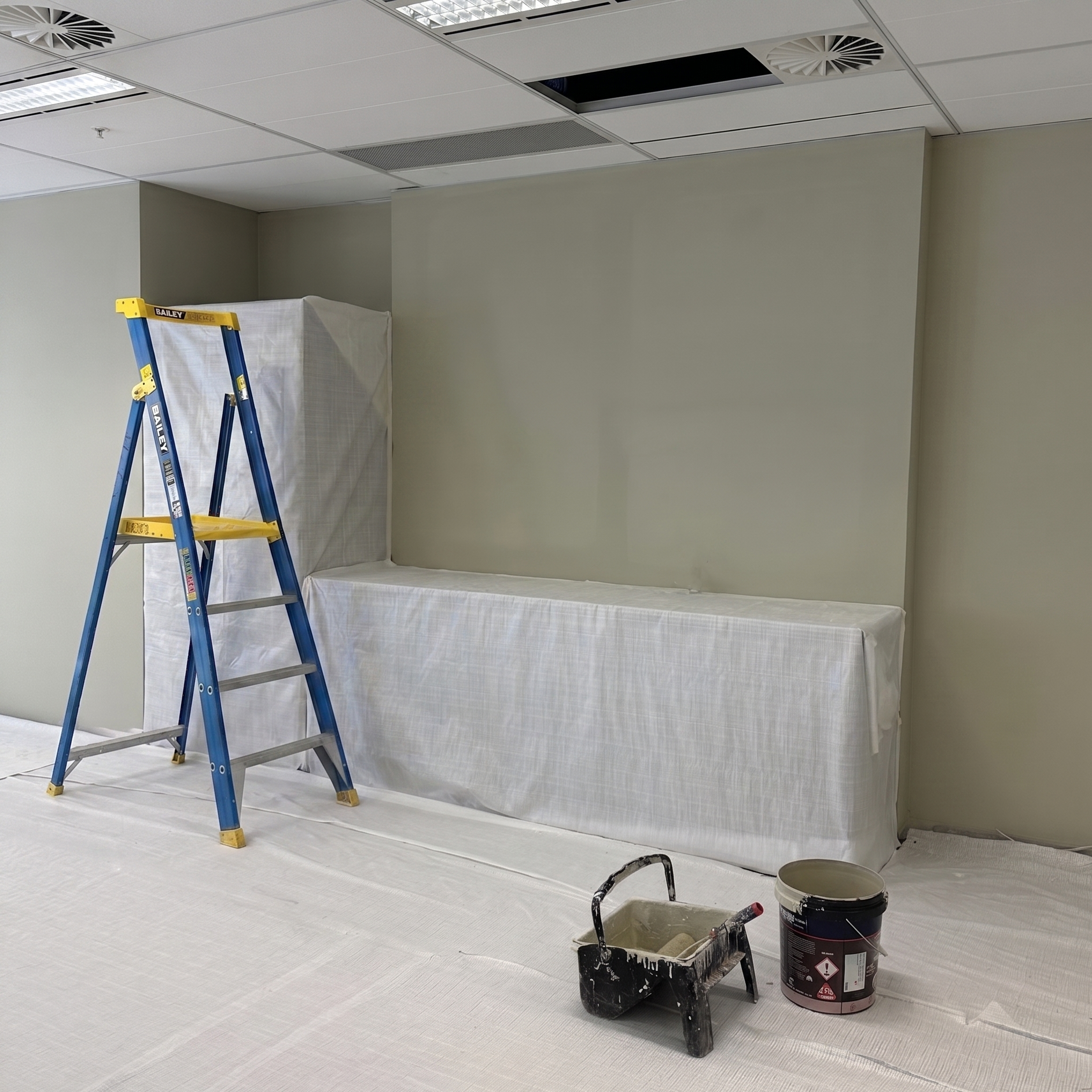 Detail of an office fitout in progress, with painting gear in foreground